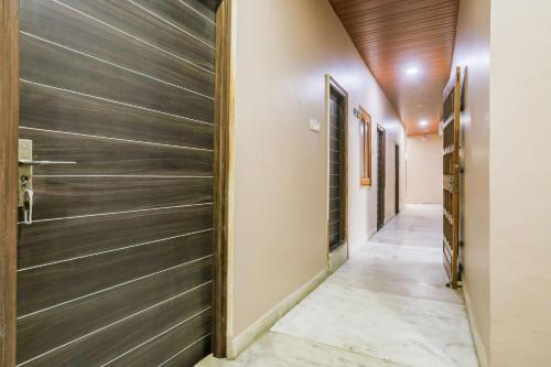 a hallway of a house with a wooden ceiling at Super Collection O Jagannath Mandir Road Formerly Paradise Residency in Rāmnagar