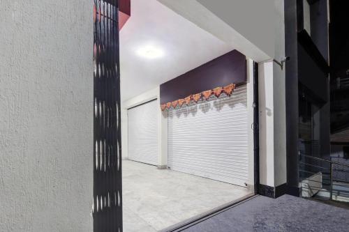 a garage door with a bunch of oranges on it at Super Collection O Virajpet City Centre formerly The Fort Mercara in Madikeri