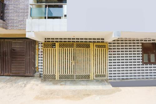 a yellow gate on the side of a building at Super Hotel O Dwarka Metro in New Delhi