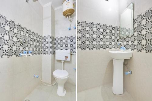 a bathroom with a toilet and a sink at Super Hotel O Dwarka Metro in New Delhi