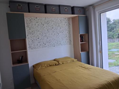 a bedroom with a bed and a window at La Belle Etape in Bangor