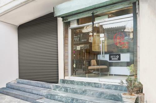 a store window with stairs in front of it at Super Hotel O Subhani Building Formerly Hotel Amandeep in Ludhiana