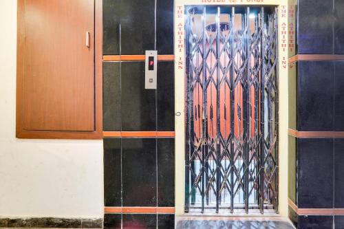a door in a building with a pattern on it at Super Townhouse Gudivada Formerly Sistla in Gudivāda