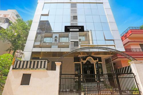 a building with a gate in front of it at Super Townhouse Cantonment Varanasi Formerly Sarin Inn in Varanasi