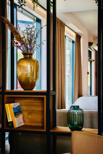 a vase sitting on a shelf in a room at Platino Mare Resort & Spa in Świnoujście