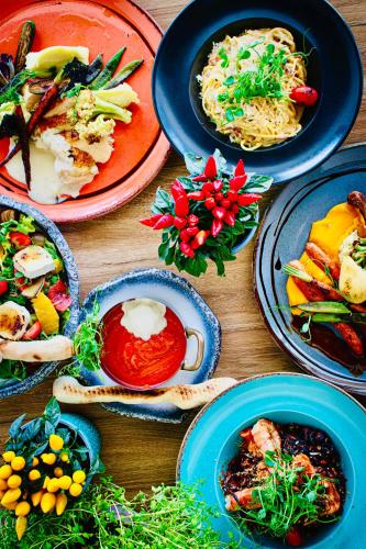 a wooden table with plates of food on it at Platino Mare Resort & Spa in Świnoujście