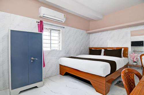 Ένα ή περισσότερα κρεβάτια σε δωμάτιο στο Super Hotel O Nicco Park Kolkata