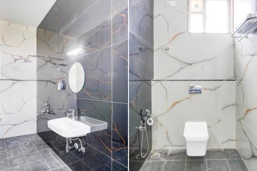 a bathroom with a sink and a toilet at Super Townhouse Hebbal Dasarahalli Formerly Otium Suites in Bengaluru