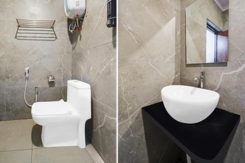 a bathroom with a white toilet and a sink at Super Townhouse Shamshabad Paradise Formerly Blue Petals Hotel in Shamshabad