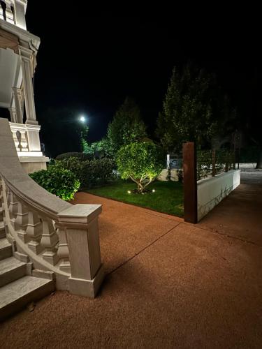 a night view of a building with a white railing at Villa Margherita in Padova