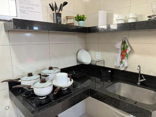 Η κουζίνα ή μικρή κουζίνα στο Residencial Portela 08C