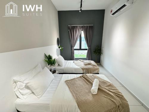 a bedroom with two beds and a window at Ipoh Horizon Skypool Town Suites 4-11pax by IWH Suites in Ipoh
