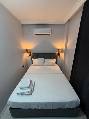 Postel nebo postele na pokoji v ubytování Pi Park Hotel