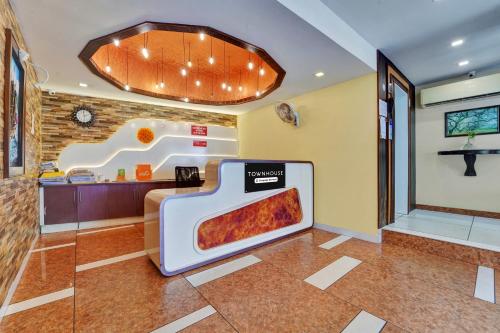 a pizza oven in the middle of a room at Super Townhouse Ernakulam North in Ernakulam
