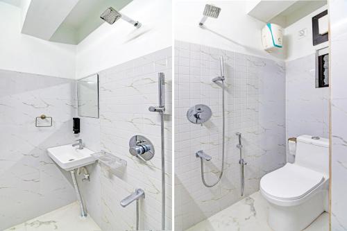 a bathroom with a shower with a toilet and a sink at Super Collection O Kolkata Near Dumdum Airport in kolkata