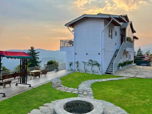 a house with a garden and a building at Peace Stay 2BHK Villa in Bhīm Tāl