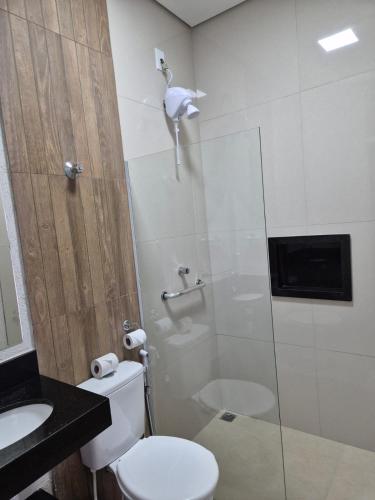 a bathroom with a shower and a toilet and a sink at Boa Vista in Carmo da Mata