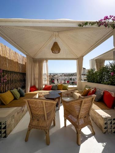 a living room with a couch and chairs at Dar Ben Turkia in Tunis