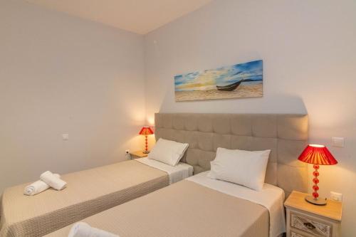 Ένα ή περισσότερα κρεβάτια σε δωμάτιο στο Ofiousa