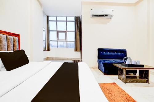 Un ou plusieurs lits dans un hébergement de l'établissement Super Townhouse Narholi Bridge Mathura