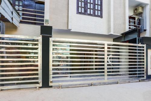 a wooden fence in front of a building at Super Collection O Gol Park Atala in Prayagraj
