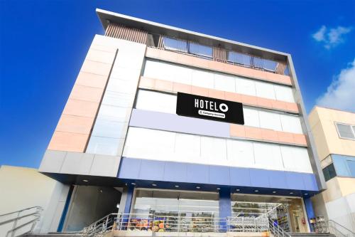 a building with a hilton sign on it at Super Hotel O Moula Ali Neredmet in Hyderabad