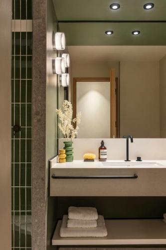 a bathroom with a sink and a mirror at Salitre Hotel, Sonder by Marriott Bonvoy in Málaga