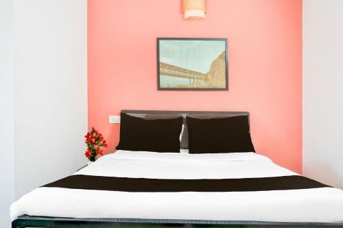 Ένα ή περισσότερα κρεβάτια σε δωμάτιο στο Super Hotel O Dhanori Near Pune Airport