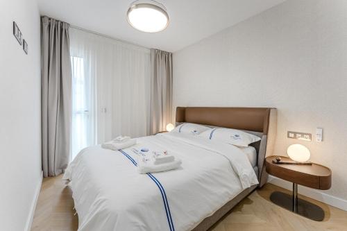 Ένα ή περισσότερα κρεβάτια σε δωμάτιο στο SeaShell Suites