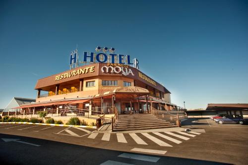 a hotel with a sign on the top of it at Hotel Moya in Honrubia