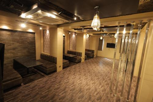 an empty room with a dance floor in a building at Hotel Pearl Square in Jaipur