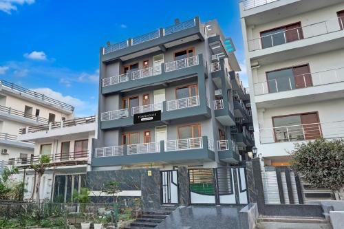 a building with balconies on the side of it at Super Townhouse Sector 135 Noida in Noida