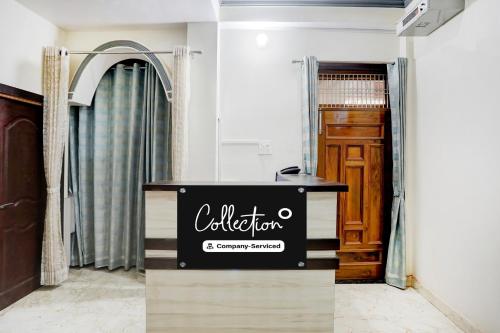 a dressing room with a sign in front of a door at Super Collection O Nagwa Lanka Varanasi in Varanasi