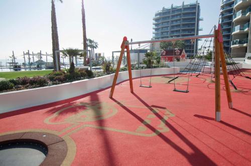 a playground on the roof of a building at Sea Senses by Mar Holidays in Torrevieja