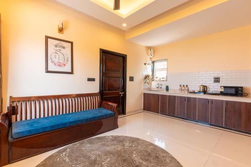 a waiting room with a bench and a counter at Peace Stay 2BHK Villa in Bhīm Tāl