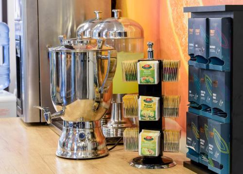 a blender sitting on top of a counter with other items at HOTEL CARPAT INN in Azuga