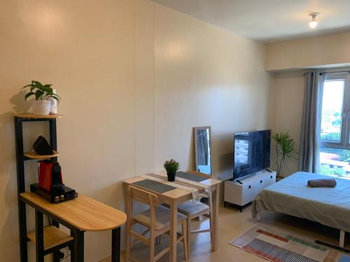 TV a/nebo společenská místnost v ubytování Avida Towers Abreeza Studio by Alexa Home AV1511