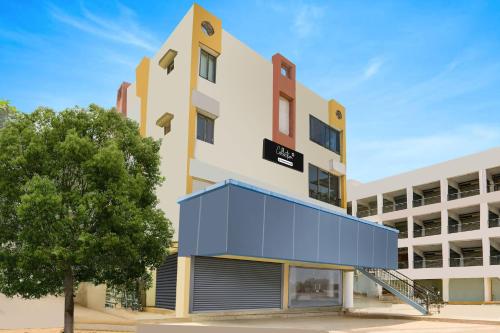 an image of the front of a building at Super Collection O Ahmedabad Airport Formerly Hotel Runway Inn in Ahmedabad