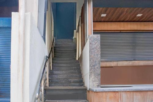 a stairway leading up to a building at Super Collection O Katraj Near KK Market in Pune