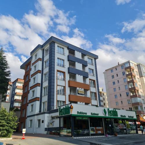 a tall building with a store in front of it at ARGEUS PRESTİJ in Kayseri