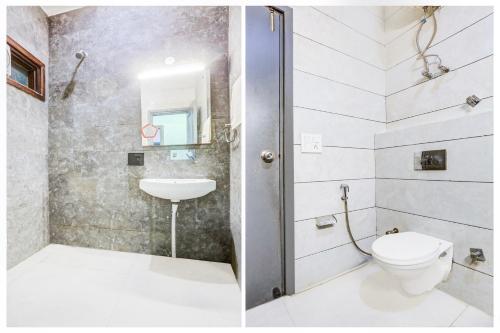 a bathroom with a toilet and a sink at Super Townhouse Rohini Sector 23 in New Delhi