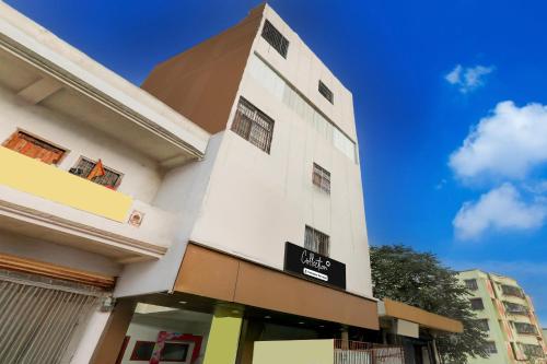 a white building with a sign on it at Super Collection O Jagdeo Path Patna in Patna