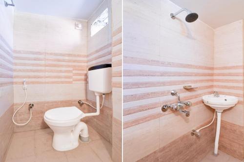 a bathroom with a toilet and a sink at Super Hotel O Bhubaneshwar Near ITER College in Bhubaneshwar