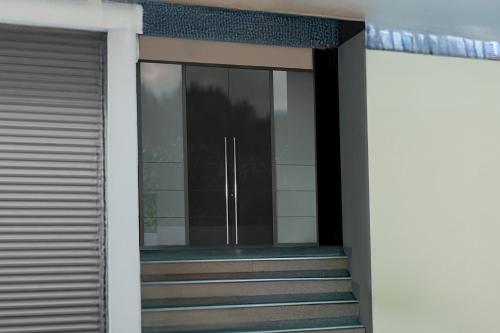 an entrance to a building with a glass door at Super Collection O Kothapet Near Omini Hospital in Upal