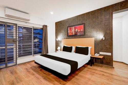 Postel nebo postele na pokoji v ubytování Super Townhouse Kanakpura Road Formerly Panchavati Comforts