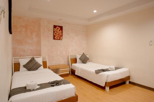 a bedroom with two beds at My Way Hua Hin Music Hotel SHA Extra Plus in Hua Hin