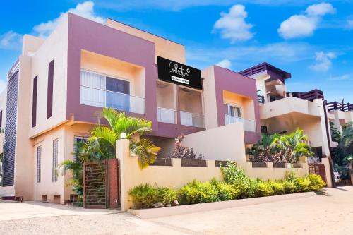 an image of a villa with purple at Collection O Varsoli Uptown formerly Carmello & Othelo Villas in Lonavala