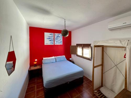 Ένα ή περισσότερα κρεβάτια σε δωμάτιο στο Casa del Encanto