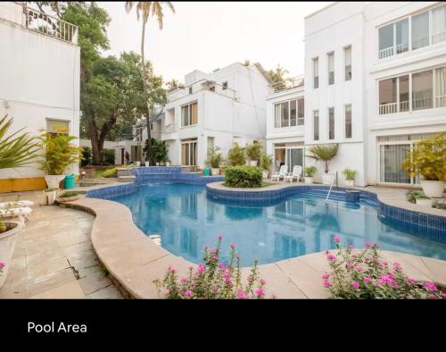 a swimming pool in the middle of a building at 3BHK villa in Candolim, Calangute - IvoryBloom in Candolim