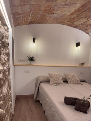 a bedroom with a large bed in a room at Can Sablet in Horta de San Joan